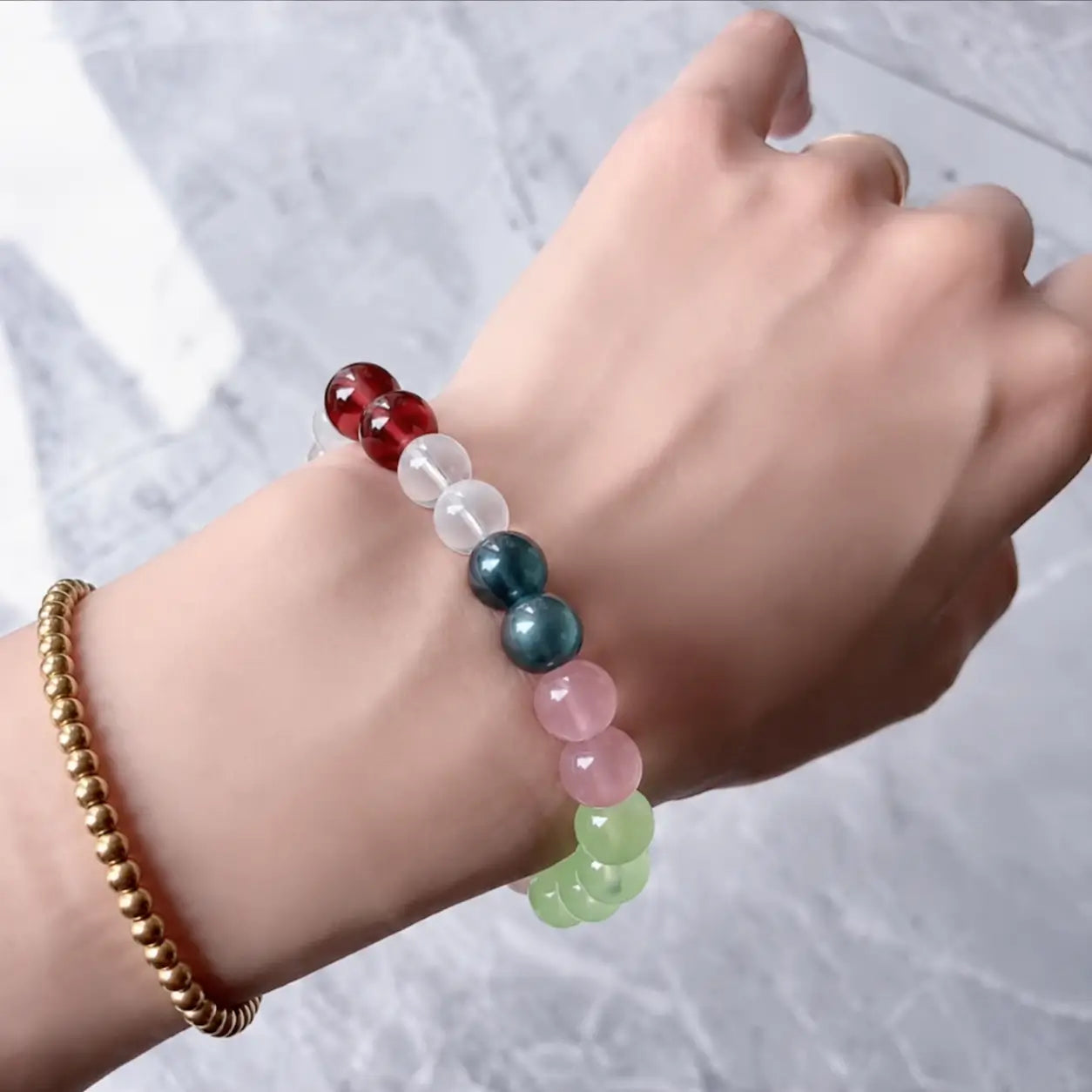 Lifestyle image of handcrafted crystal bracelets worn in everyday settings, reflecting minimalist design, personal style, and a calm modern aesthetic.