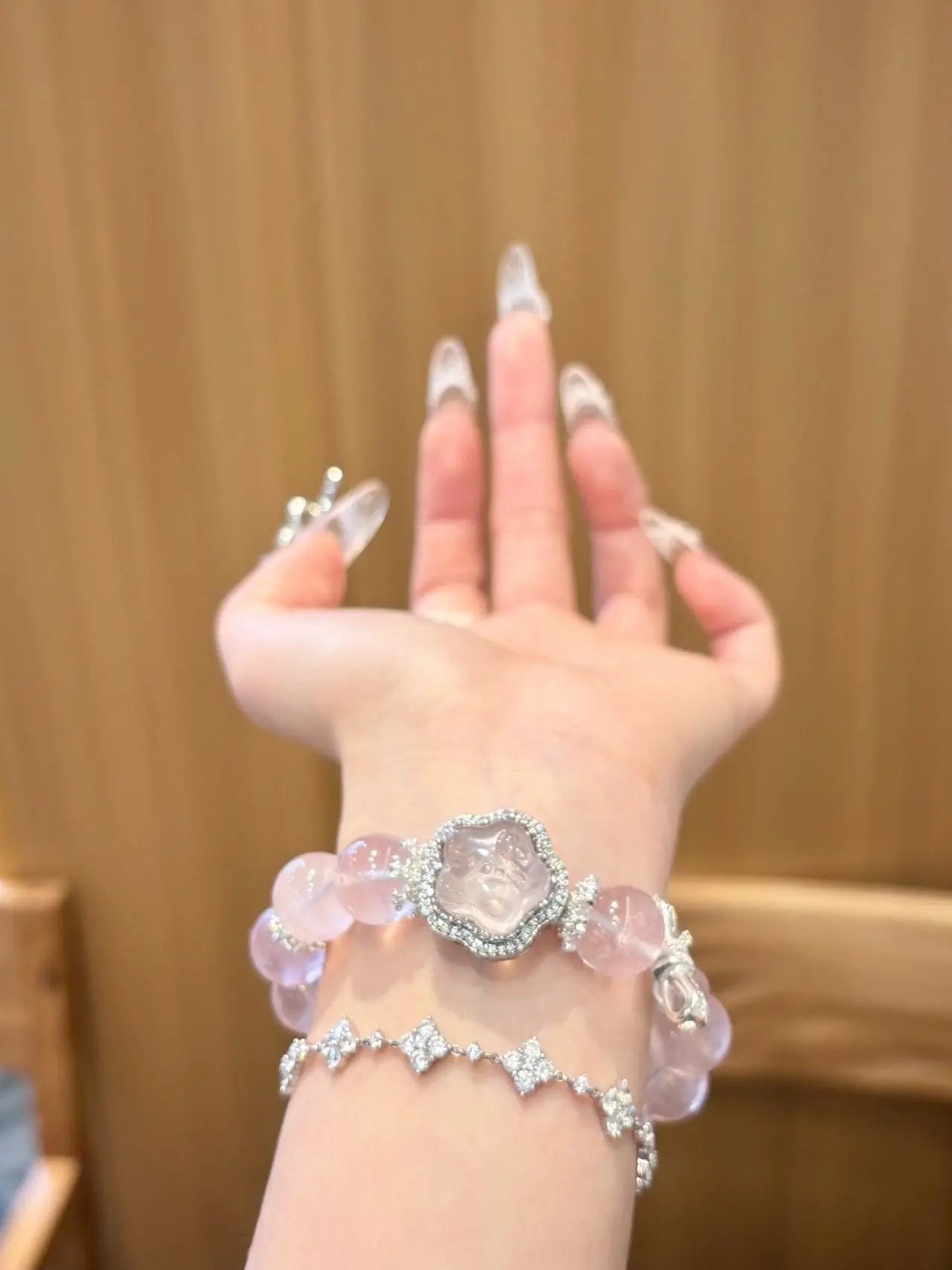 Lifestyle image of handcrafted crystal bracelets worn in everyday settings, reflecting minimalist design, personal style, and a calm modern aesthetic.